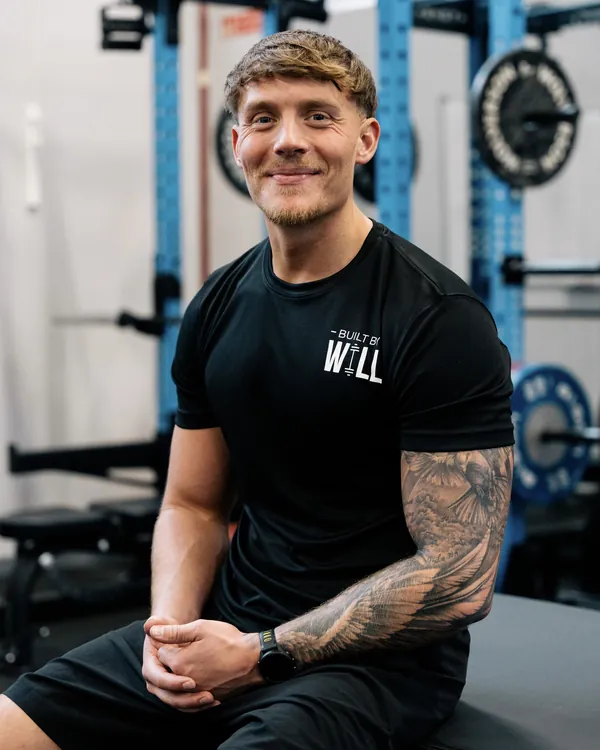 Will seated in a gym