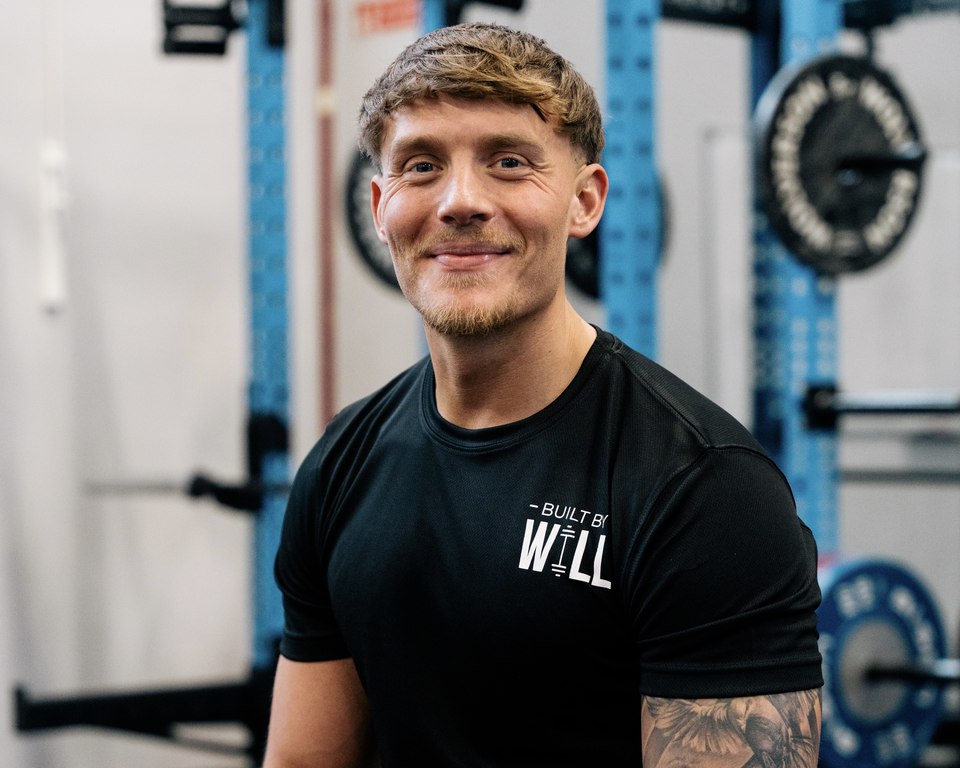 Will seated in a gym